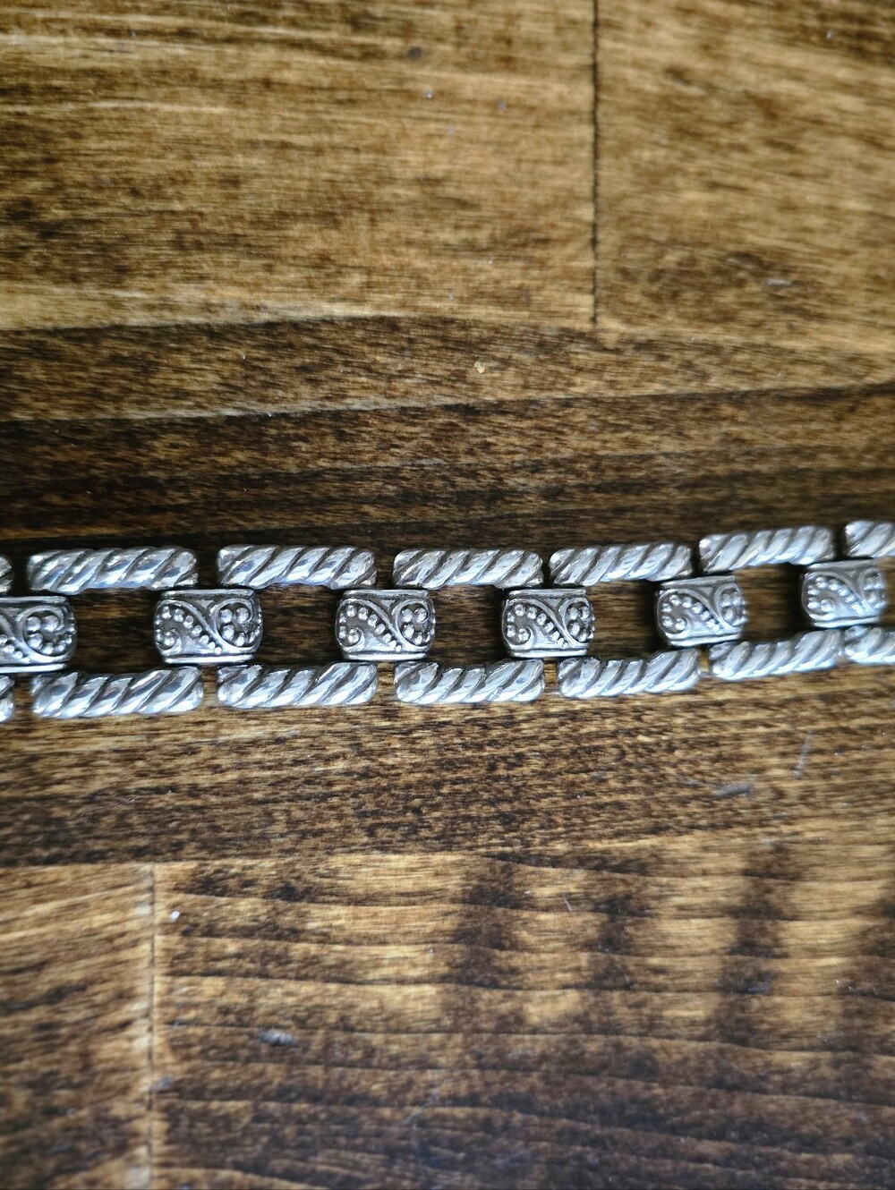 Elegant Silver-Tone Link Bracelet with Intricate Rope and Filigree Detail